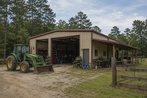 Small farm-style property with pasture, acreage, and outbuildings near Holmes County Florida